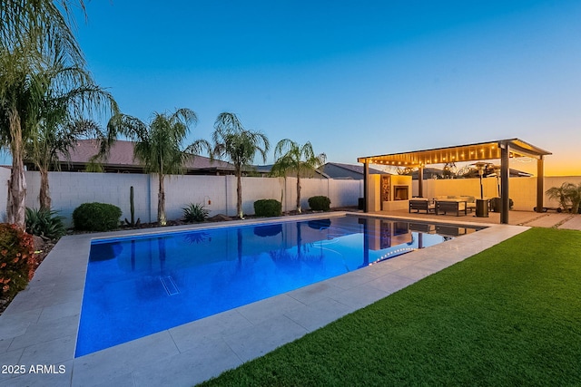 view of pool with a fenced in pool, a yard, a fenced backyard, and a patio area