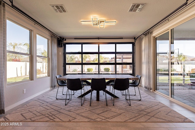 sunroom / solarium featuring visible vents