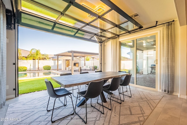 view of patio with visible vents, outdoor dining space, a fenced in pool, and fence private yard