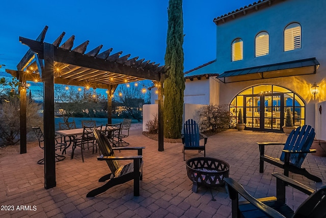 patio terrace at dusk with a pergola