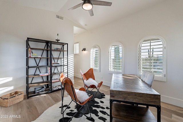 office with ceiling fan, lofted ceiling, and light hardwood / wood-style flooring