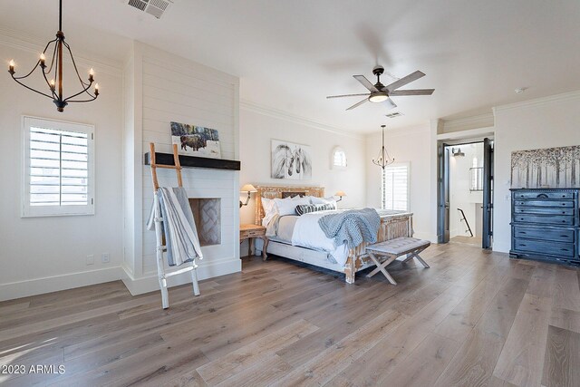 bedroom with light wood-type flooring, ceiling fan, and crown molding