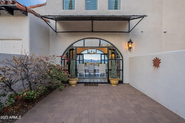 property entrance with a patio