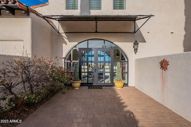 entrance to property featuring french doors