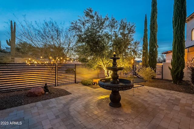 view of patio terrace at dusk