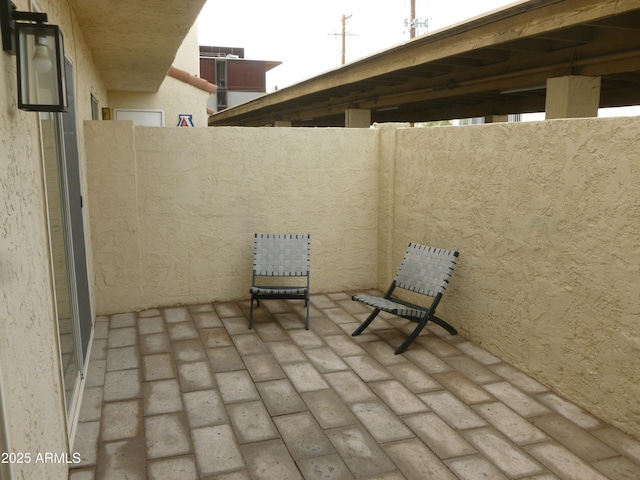 view of patio featuring fence