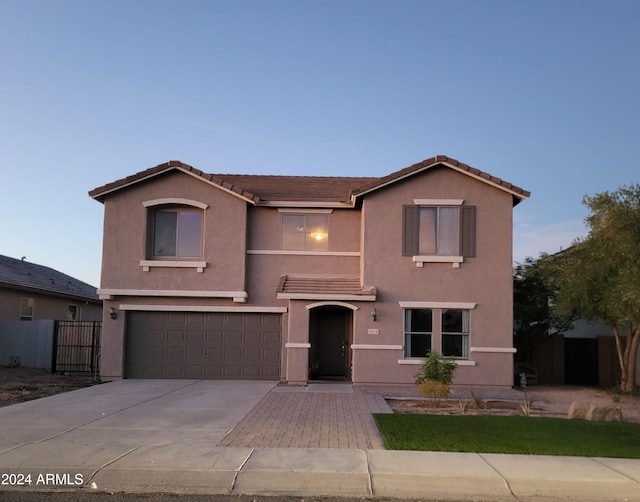 front of property with a garage