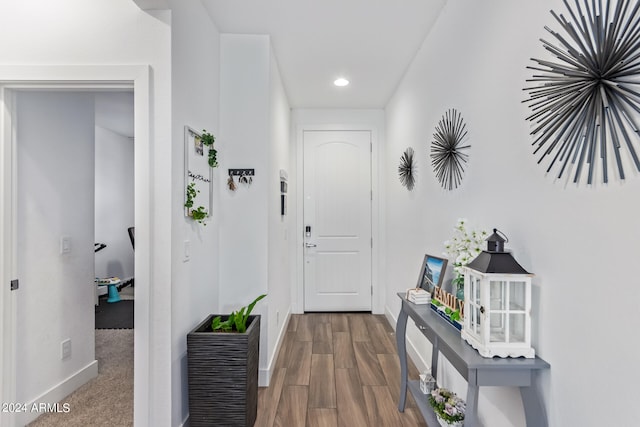 hall with hardwood / wood-style floors