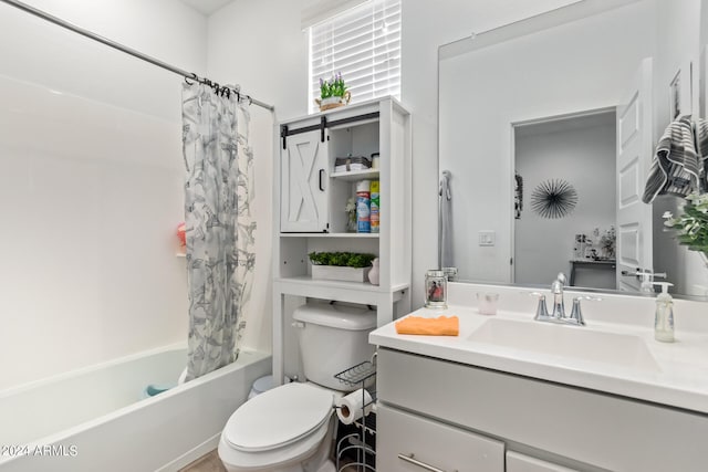 full bathroom with shower / tub combo, vanity, and toilet