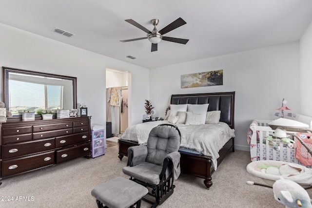 bedroom featuring ceiling fan and light colored carpet