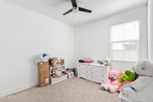 playroom with light carpet and ceiling fan