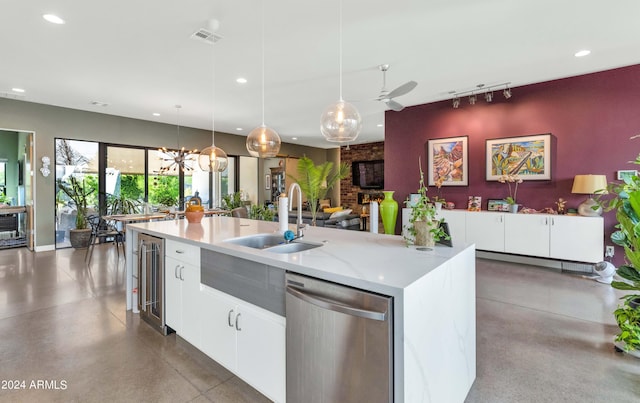 kitchen featuring ceiling fan, sink, decorative light fixtures, white cabinetry, and dishwasher