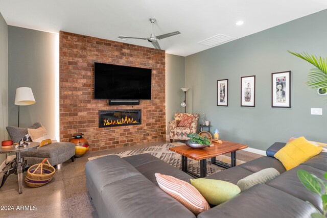 living room featuring ceiling fan and a fireplace