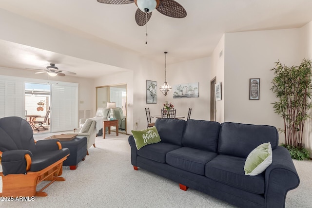 living room featuring ceiling fan, carpet floors, and visible vents