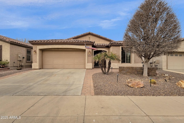 mediterranean / spanish-style house featuring a garage