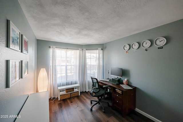 home office featuring hardwood / wood-style floors and a textured ceiling