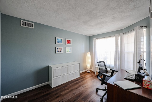 office featuring a textured ceiling and dark hardwood / wood-style flooring