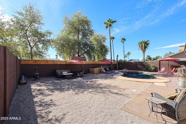 view of yard with a fenced in pool and a patio