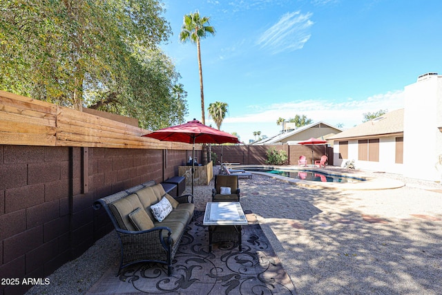 view of patio featuring a fenced in pool