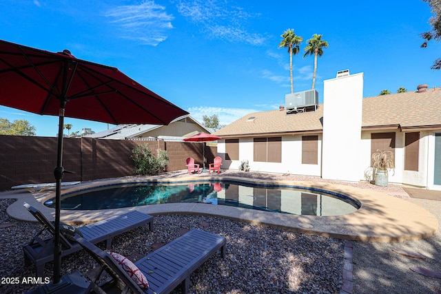 view of pool featuring a patio and cooling unit