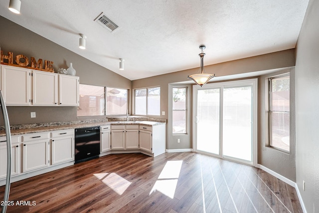 kitchen featuring pendant lighting, lofted ceiling, white cabinetry, black dishwasher, and dark hardwood / wood-style flooring