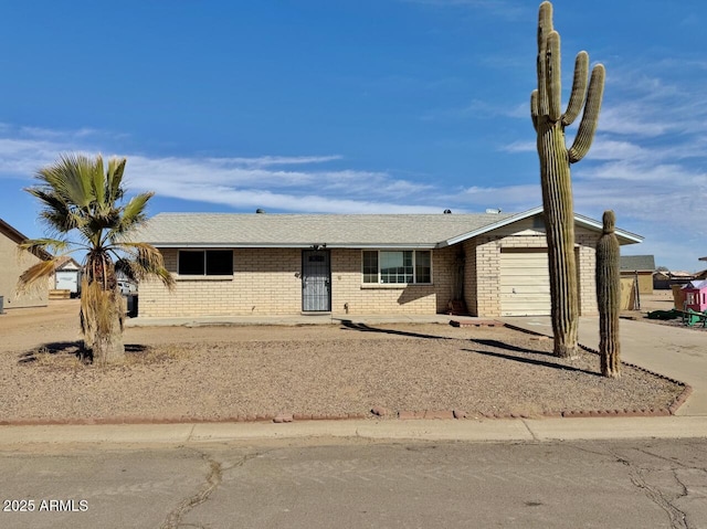 ranch-style house featuring a garage