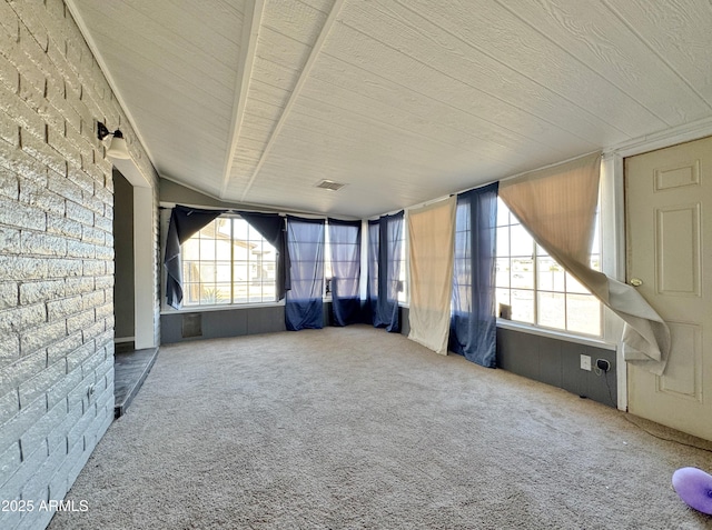 interior space featuring brick wall and carpet