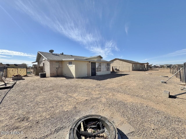 rear view of house with central AC