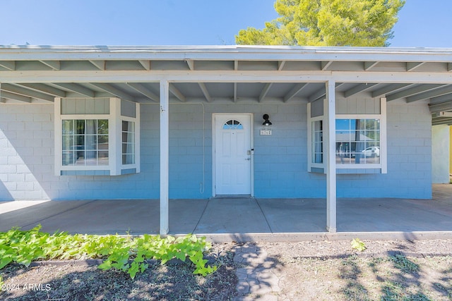 entrance to property with a carport