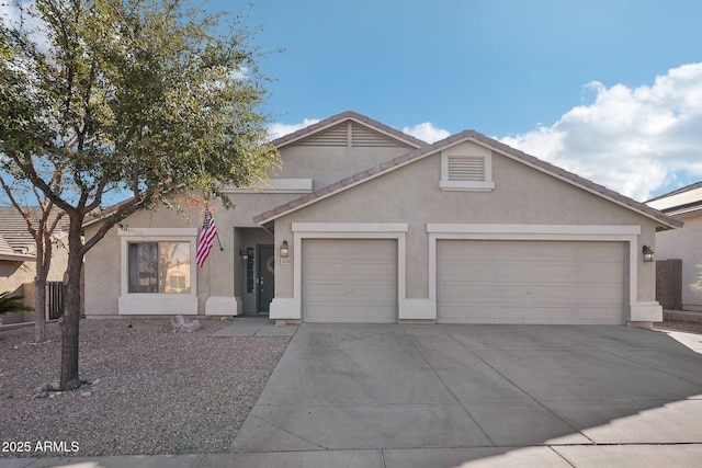 view of front of property with a garage