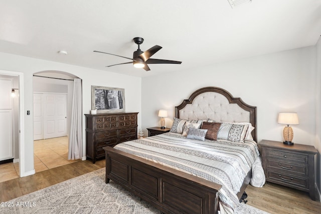 bedroom featuring ceiling fan and wood-type flooring