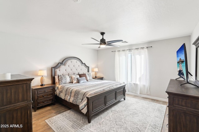 bedroom featuring ceiling fan and light hardwood / wood-style flooring