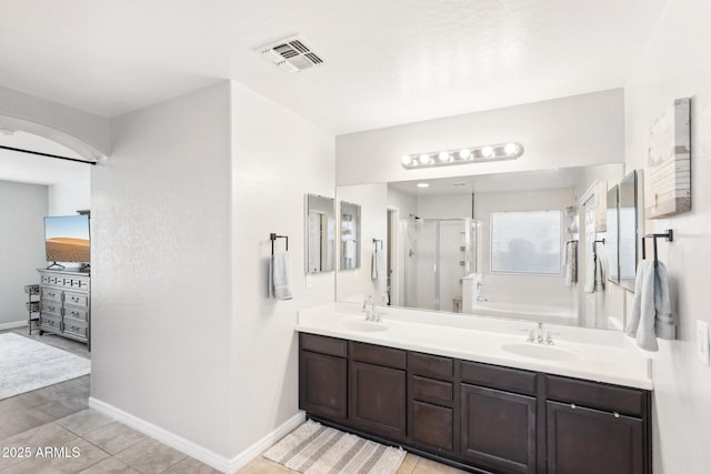 bathroom featuring vanity, tile patterned floors, and an enclosed shower