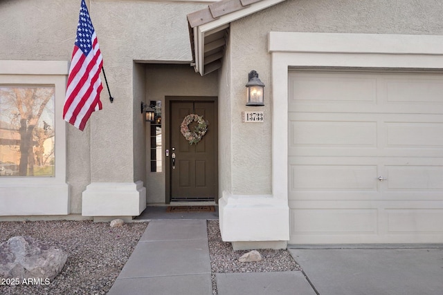 entrance to property featuring a garage