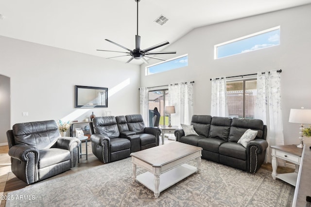 living room featuring ceiling fan, lofted ceiling, and hardwood / wood-style floors