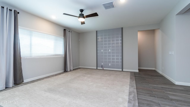 unfurnished room featuring ceiling fan, recessed lighting, baseboards, wood finished floors, and visible vents