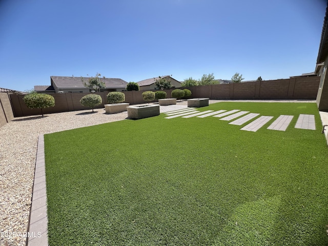 view of yard featuring a patio and a fenced backyard