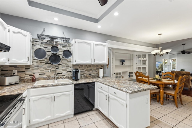 kitchen with sink, dishwasher, white cabinets, ceiling fan with notable chandelier, and kitchen peninsula