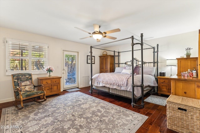 bedroom featuring access to outside, dark hardwood / wood-style floors, and ceiling fan