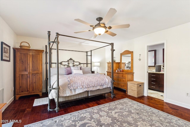 bedroom with dark hardwood / wood-style flooring and ensuite bath