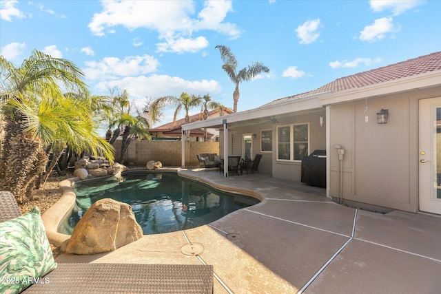 view of swimming pool with a patio