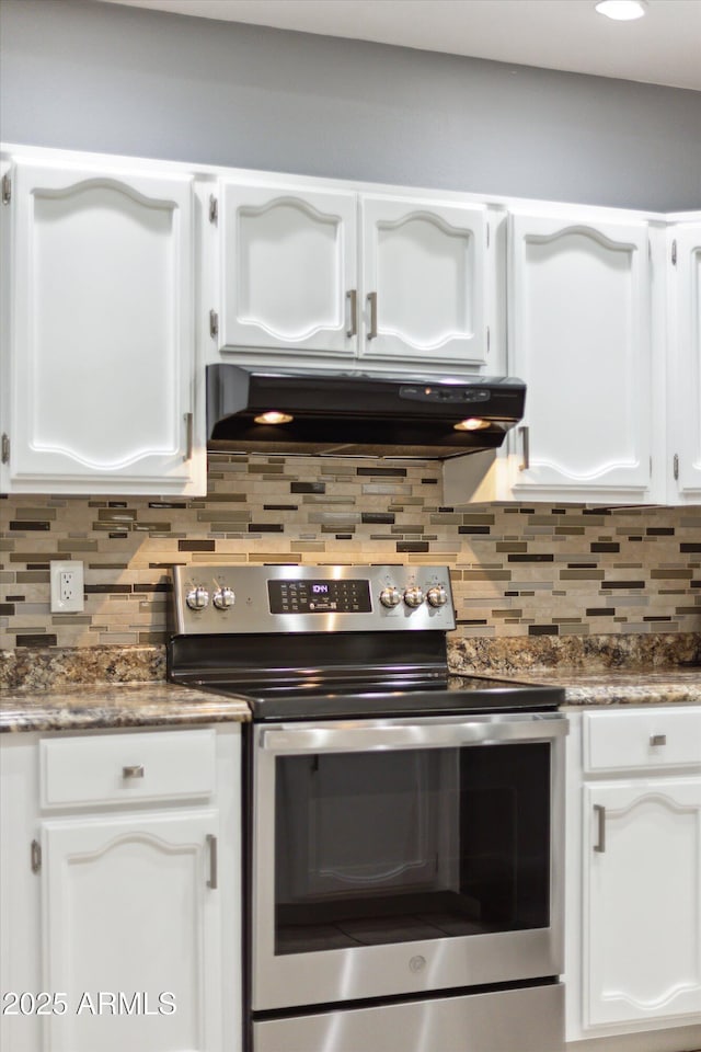 kitchen with ventilation hood, white cabinetry, decorative backsplash, and electric stove