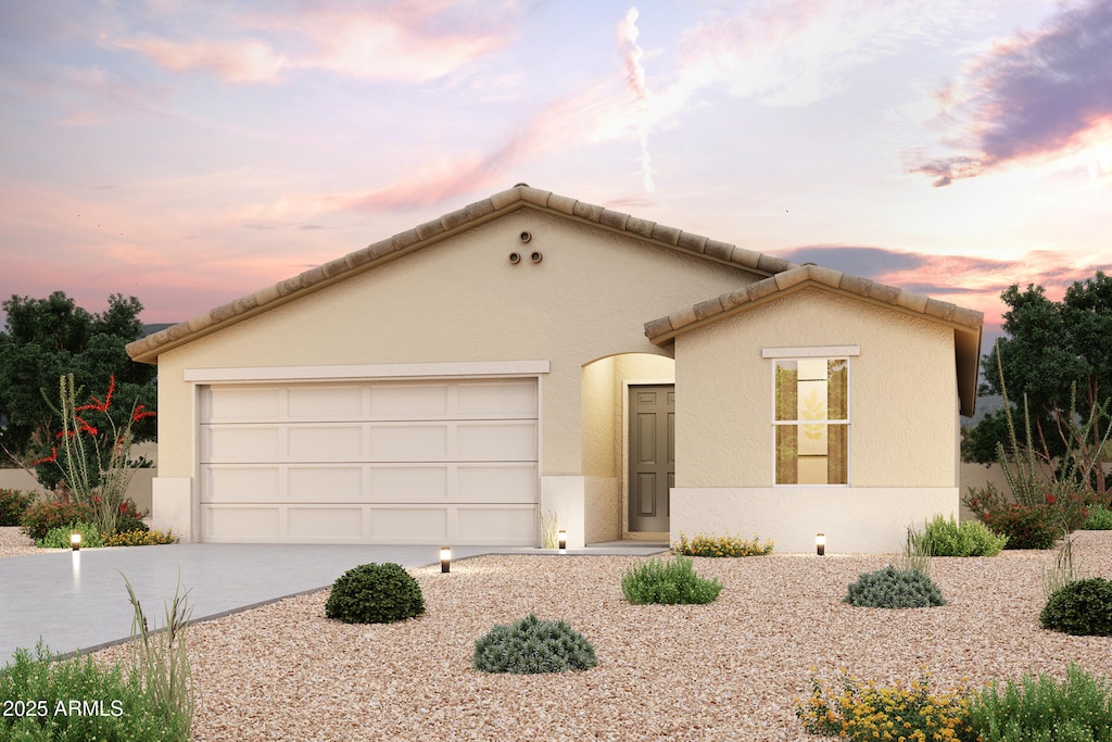 single story home with driveway, stucco siding, and an attached garage