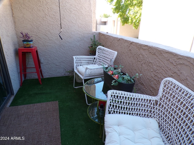 view of patio / terrace with a balcony