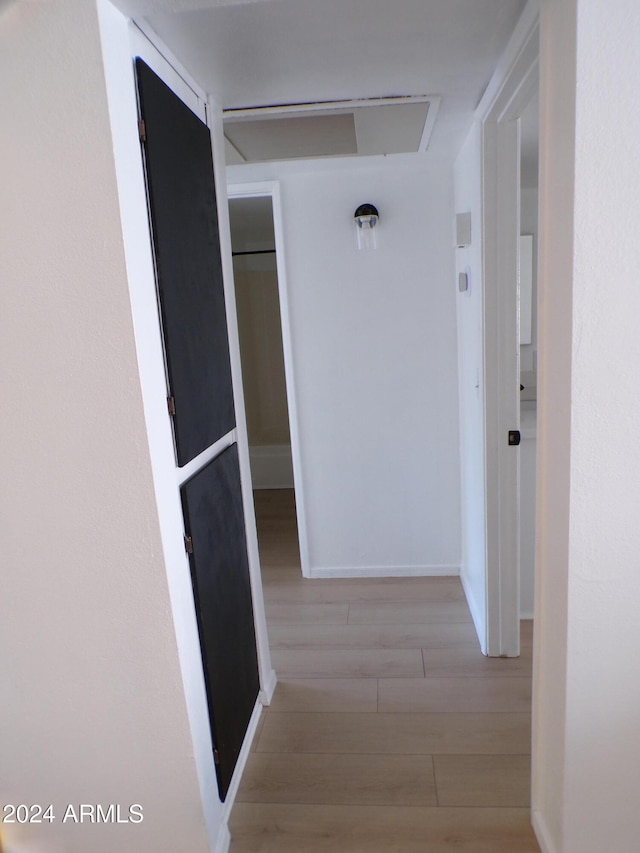 hallway featuring light hardwood / wood-style flooring