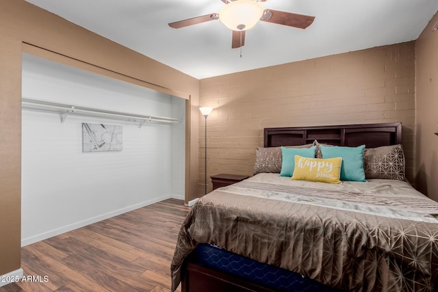 1133 N 84th Pl, Scottsdale, AZ 85257 - bedroom featuring wood finished floors, ceiling fan, and brick wall
