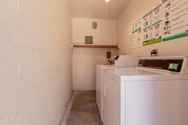 1133 N 84th Pl, Scottsdale, AZ 85257 - community laundry room featuring washing machine and dryer and concrete block wall