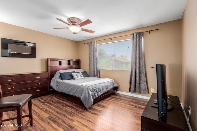 1133 N 84th Pl, Scottsdale, AZ 85257 - bedroom with dark wood-style floors and a ceiling fan