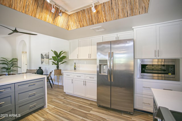 6608 E Ranch Rd, Cave Creek, AZ 85331 - kitchen featuring stainless steel appliances, rail lighting, light countertops, gray cabinetry, and ceiling fan