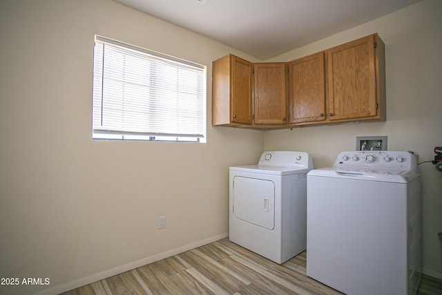 6608 E Ranch Rd, Cave Creek, AZ 85331 - laundry area with washing machine and clothes dryer, cabinet space, and light wood finished floors